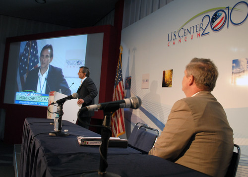 Agriculture Secretary Tom Vilsack watches the Honorable Carlos Pascual, United States Ambassador to Mexico speaking at the United Nations Climate Change Conference in Cancun, Mexico on Thursday, December 9, 2010. 