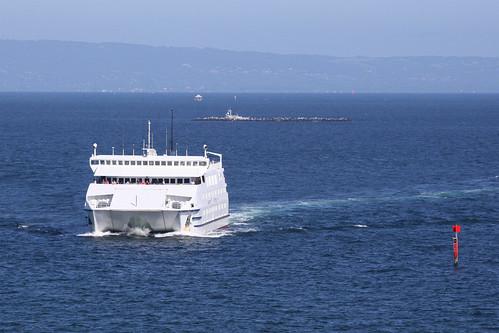 MV Queenscliff crosses the bay, Pope's Eye and Chinaman's Hat in the background