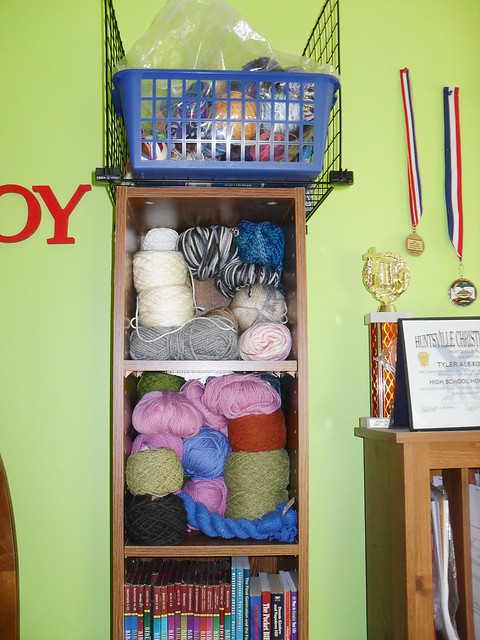bookshelf of yarn stash at Tyler Handmade