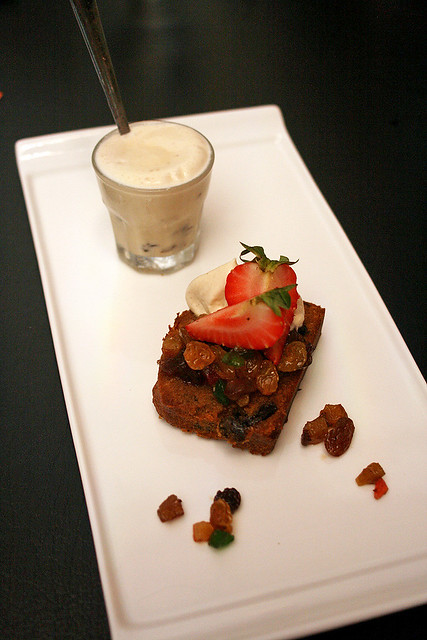 Rich fruit cake with shot glass of whisky-vanilla ice cream