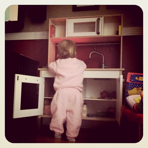 Playing in her new kitchen