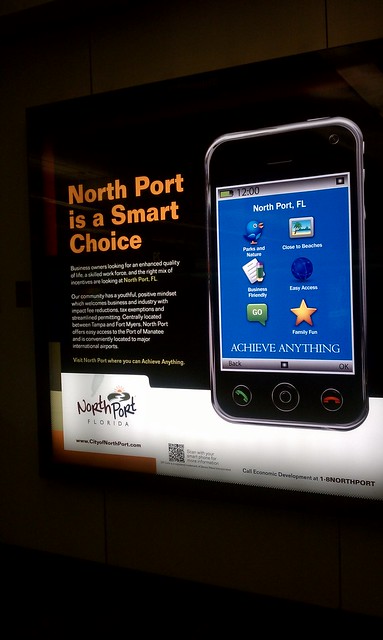 Info display at the Orlando airport with a QR tag.