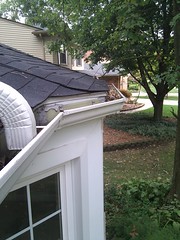 Downspout emptying into eave