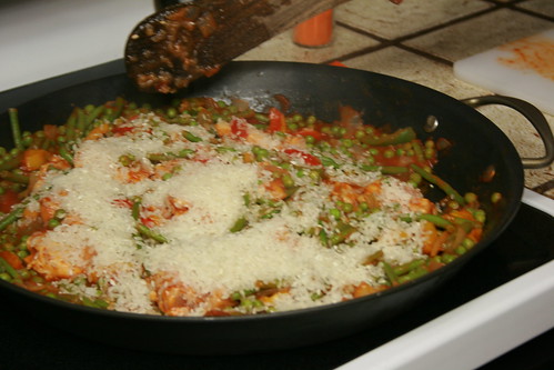 Adding rice to the paella