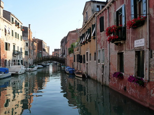Reflections on quiet canal, Venice, Italy