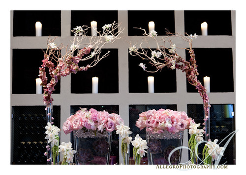 grace-ormonde-tabletop-mimosa-style- detail of willow branches and orchids with candles in background- wedding inspirations- pink white green lavender burgundy