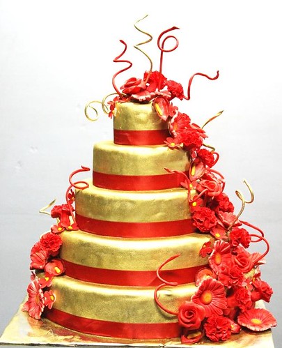 Red Gold 5 tier Wedding cake with Floral sugarflower arrengement