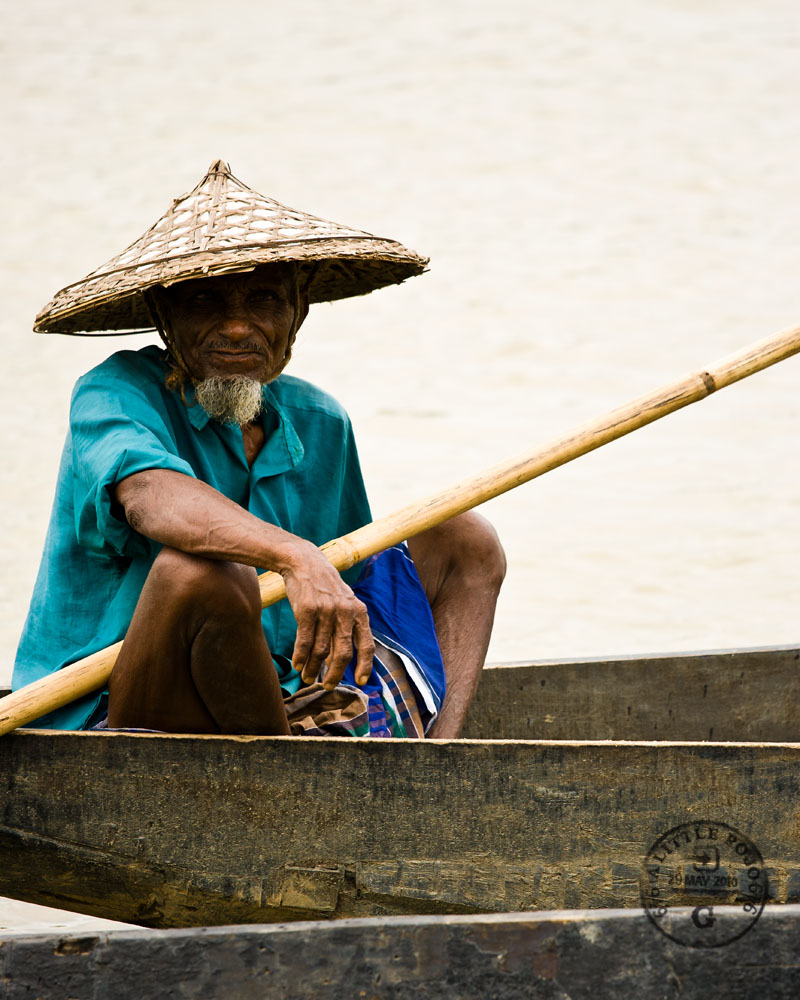 A river boatman on the Surma River, near Sylhet, Bangladesh