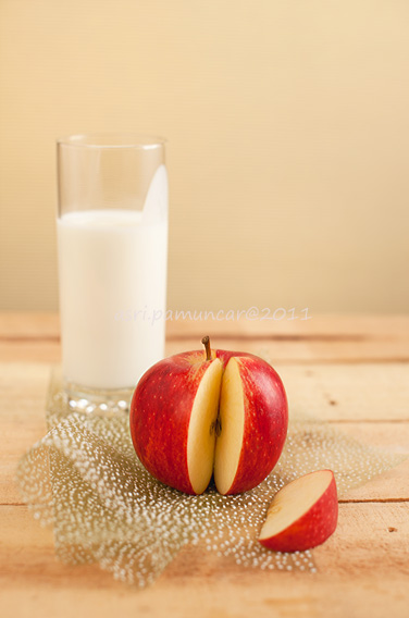 an apple & a glass of fresh laban