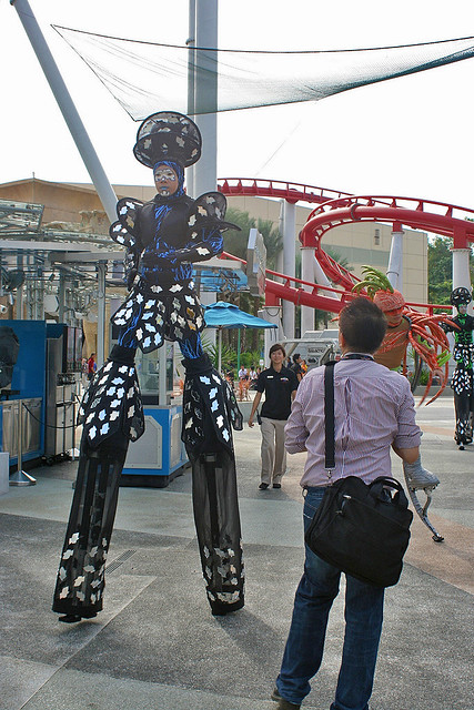Modern stiltwalkers with new-fangled metal stilts and jumping stilts