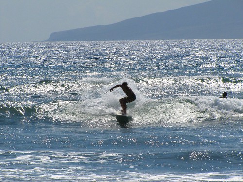 surfer on the glittering waves