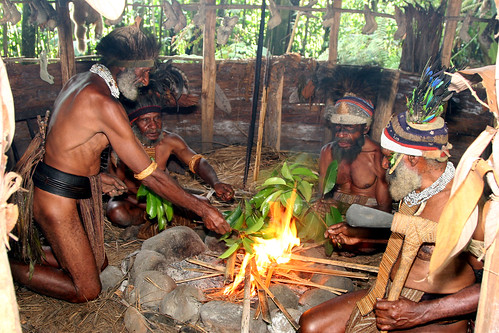 Melpa men of the Tokua village near Mt Hagen, Papua New Guinea perform a moka where they exchange gifts and confer on village matters.