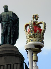 plaster crown sculpture on top of flag pole ahead of royal wedding Statue the mall London 12th April 2011 15:02.26pm