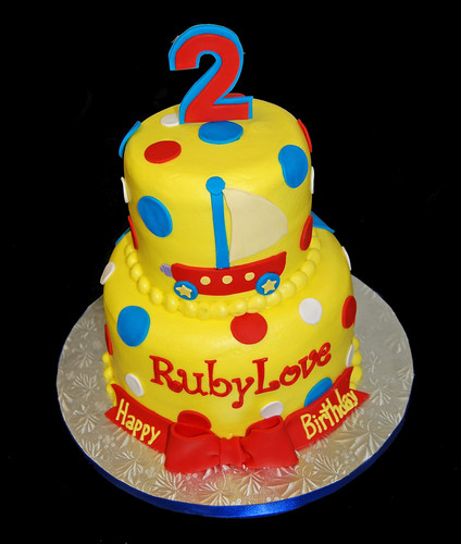 yellow red and blue 2nd birthday cake for a Wonder Pets celebration