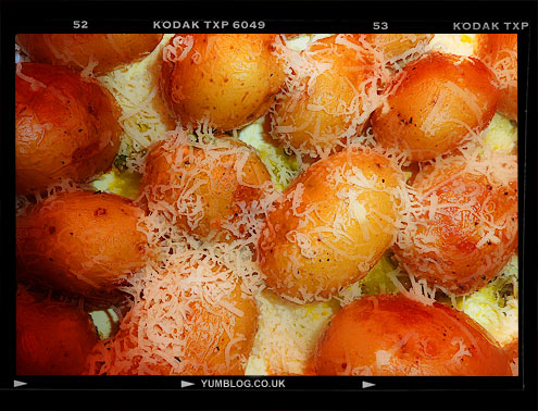 Baked new potatoes with cheese sauce