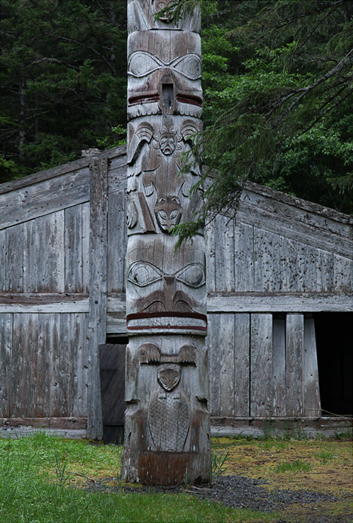frontal totem pole and Naay I'waans, Chief Son-i-Hat Whale House, Kasaan, Alaska