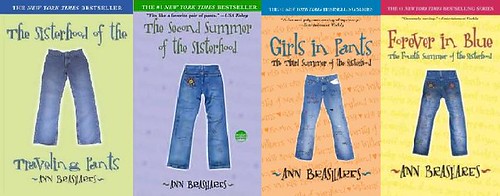All four original covers of the YA series: The Sisterhood of the Traveling Pants, The Second Summer of the Sisterhood, Girls in Pants, and Forever in Blue. The covers are green, purple, orange, and yellow, respectively, and each has a simple picture of a pair of blue jeans on the front.
