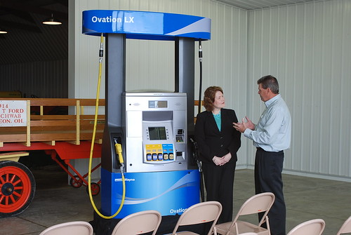 Judith Canales, USDA Rural Business-Cooperative Administrator is pictured with Glen Badenhop, co-owner of American Freedom Energy as he discusses a Flex-Fuel pump.