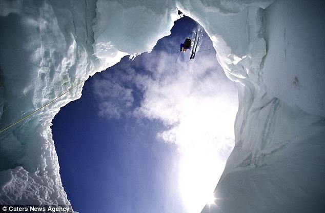 Going downhill... fast! Free skier takes amazing 600-feet leap off mountain cliff face  2
