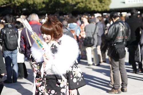 Girl in kimono holding a Hamaya