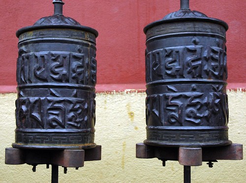 Om Mani Padme Hung, Prayer Wheels, copper and wood, iron,  Tharlam Monastery in the rain, Boudha, Kathmandu, Nepal by Wonderlane