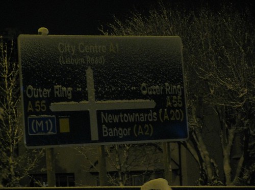 Night time snowy N.I. road sign