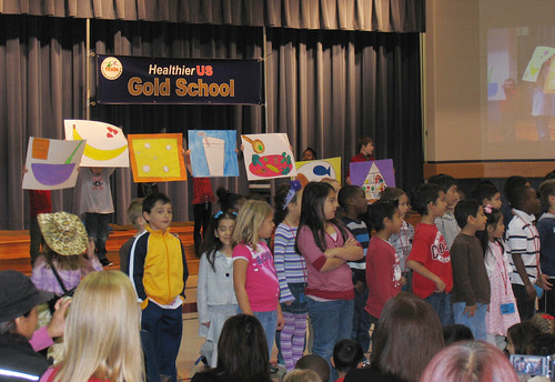 Students at Minshew Elementary School celebrated the receipt of the gold award in the HealthierUS School Challenge by singing about healthy foods.