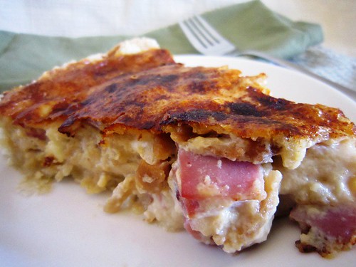 A slice of ham and cheese quiche