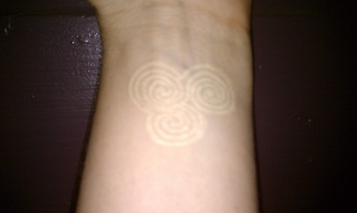 triple spiral tattoo