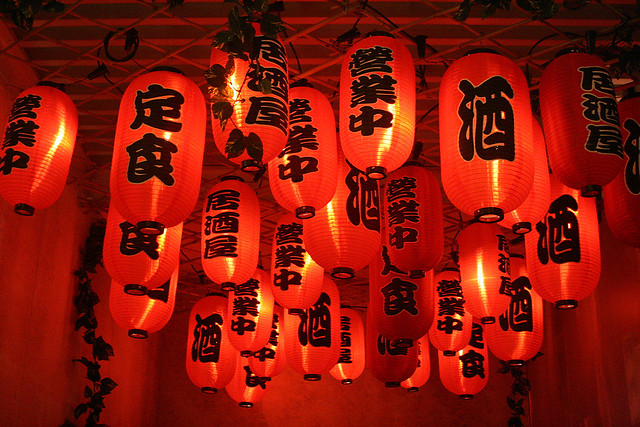 Red lanterns adorn the entrance to the rooftop bar