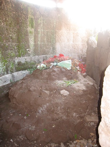 Temple of the Deified Julius Caesar, where caesar's body was burned, locals have left flowers on the altar