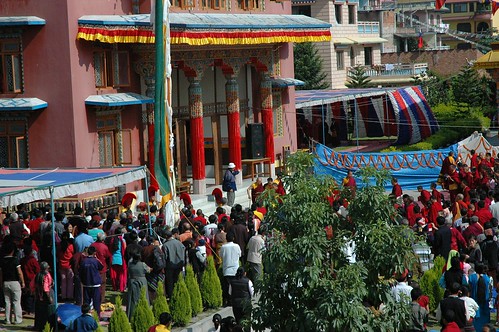 Tibetan Buddhist crowds welcome His Holiness Dagchen Rinpoche, red white and blue tents, Sakya Lamdre, Tharlam Monastery Courtyard, Tibetan Buddhism, Boudha, Kathmandu, Nepal by Wonderlane