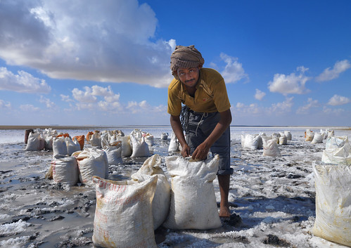Pakistani worker in Barr Al Hikman salted lake - Oman