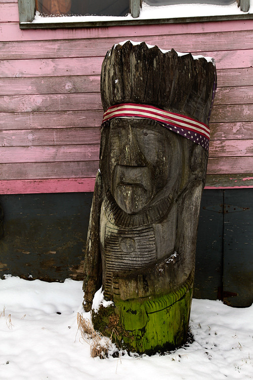 wood sculpture and snow, Craig, Alaska