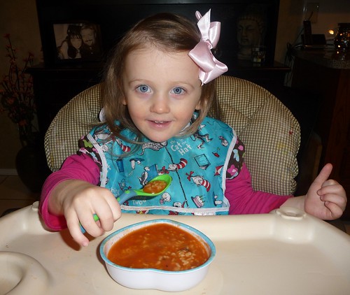 girl eating alphabet soup