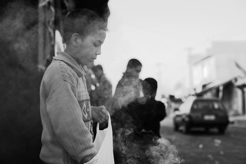 kabul afghanistan city. Kabul, Afghanistan. Boy burning inscense to fight off bad spirits.