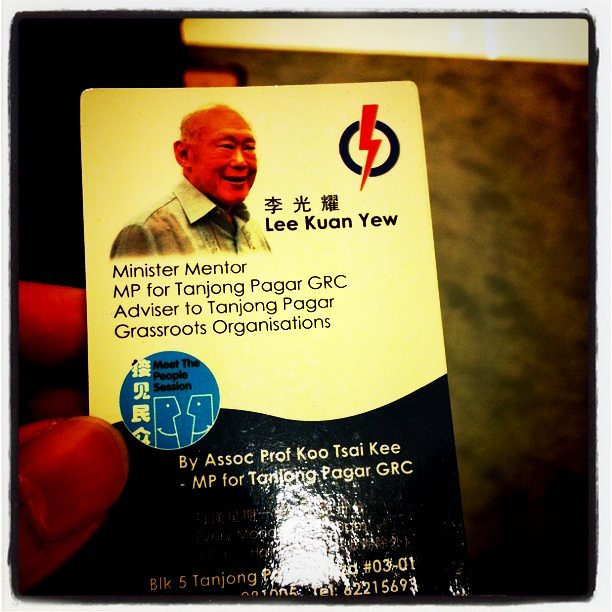 Old salesman shows me a LEE KWAN YEW card