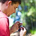 Grad student Chase Mendenall holds a captured bird at Jasper Ridge.