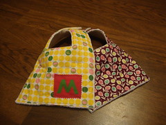 A pair of bibs for a friends baby girl