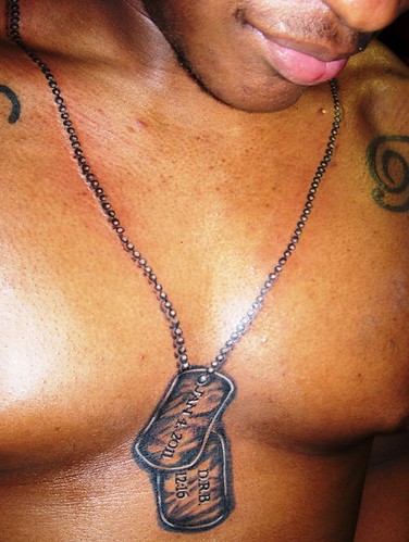 Dog Tags around neck and on chest by conspiracy ink tattoos