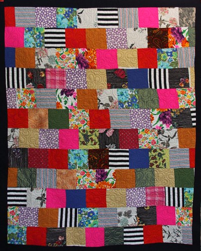This quilt was made using recycled and vintage fabrics.