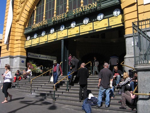 Steps of Flinders Street, covered with people bumming around as per usual
