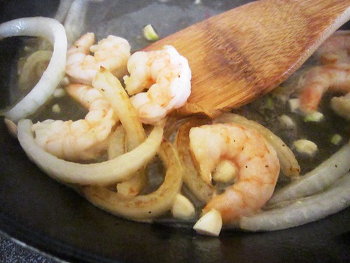 Sauteing shrimp and onion, take one