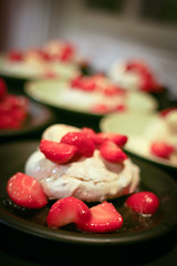 Pistachio pavlova with strawberries and ice cream