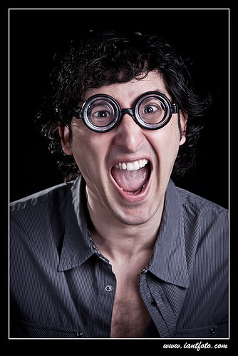 Man with  glasses screaming.