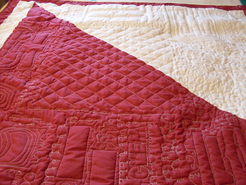 Backing showcasing quilting designs