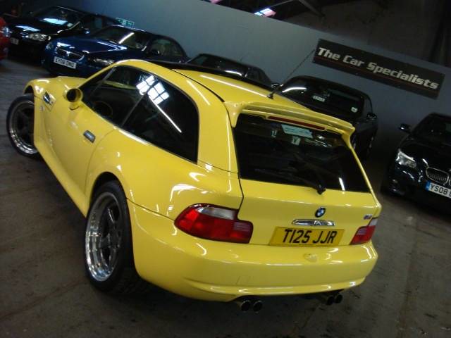 Dakar Yellow M Coupe with AC Schnitzer Type II wheels, AC Schnitzer Type II spoiler, AC Shnitzer splitters, AC Schnitzer pedals, AC Shnitzer ebrake handle, and Apline head unit