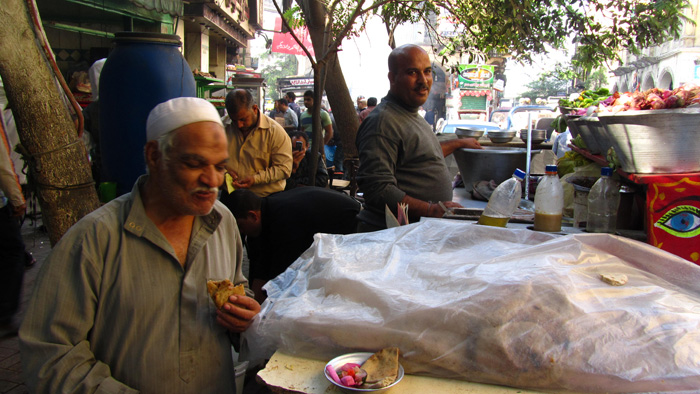Man Eating Ful Medames in Egypt