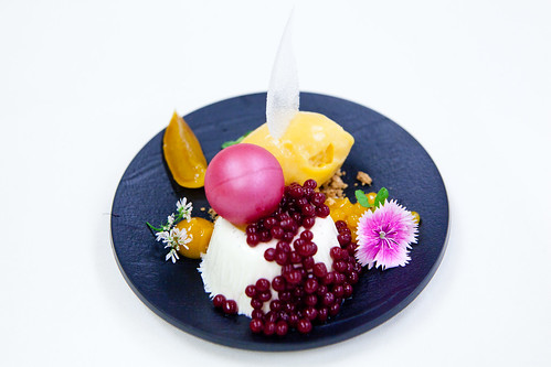 Panna Cotta with Peach sorbet, Morello cherry and peach pearl, cherry gel sheet, and cellophane of sugar