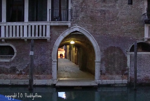 Venice nighttime canal arch